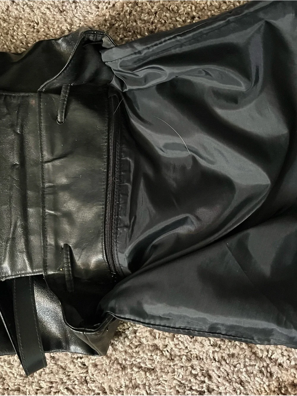JJs House Black Leather Drawstring Flap Backpack